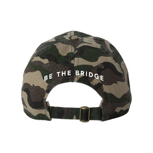 Traditional Camouflauge Cap with white BE THE BRIDGE in the center.